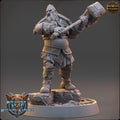 Minisculpture of a bearded warrior holding a hammer on a gray background with 'Daybreak Miniatures' branding.