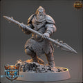 Minisature figure of a warrior with armor and spear on a gray background