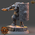 Minisature figure of a creature with a weapon and shield on a gray background, featuring Daybreak Miniatures branding.
